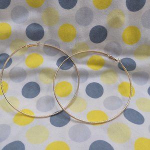 HUGE gold tone hoop earrings
